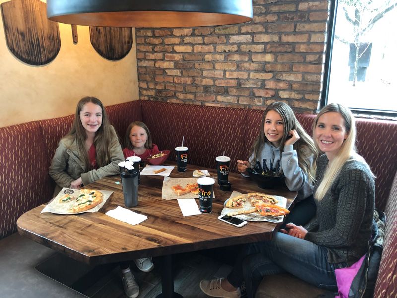 A group of friends enjoying Firo pizza